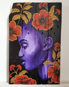 Peinture sur bois de Coraline Van Butsele, portrait de femme africaine dans un esprit wax